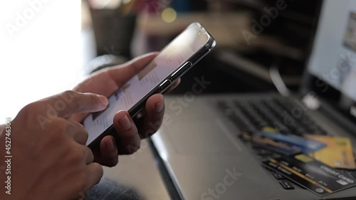scene taken. a man online shopping. with smartphones and laptops.