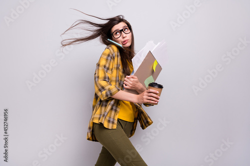 Tableau sur toile Profile side photo of young woman talk smartphone hurry go walk project deadline