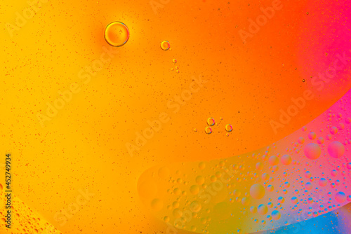Colorful of oil drop floating on the water.Fantastic structure of colorful oil bubbles
