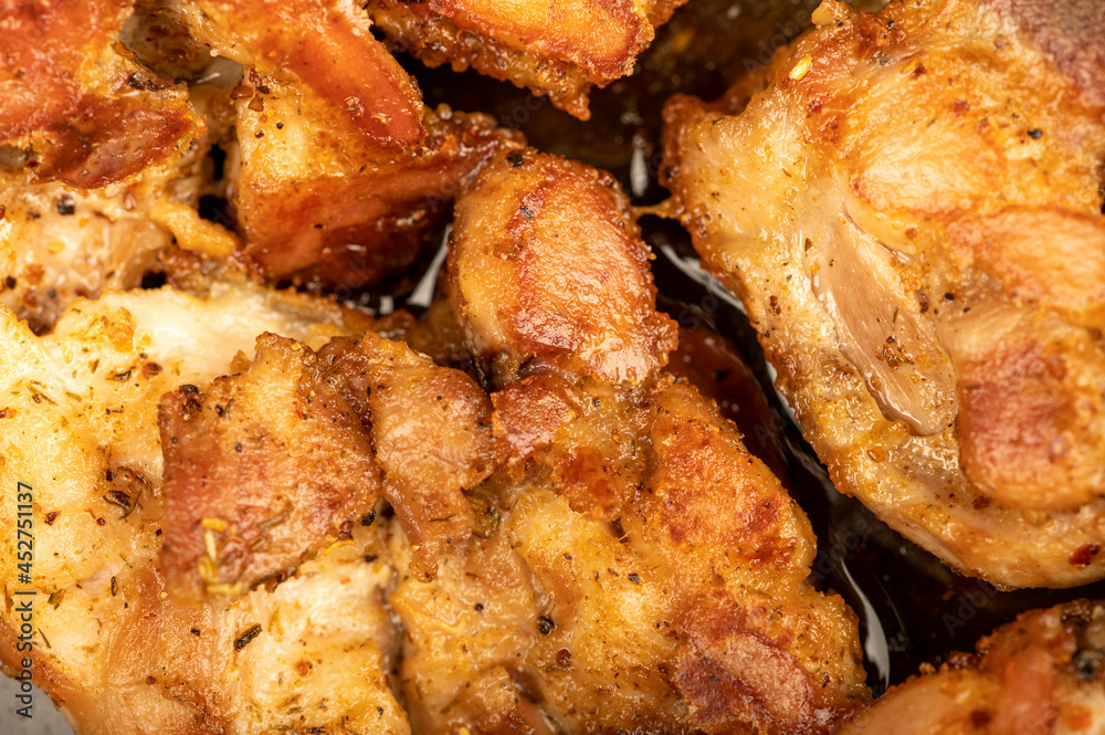 Fried pieces of meat in a frying pan, close-up, selective focus. Fried pieces of meat in a frying pan, close-up, selective focus.