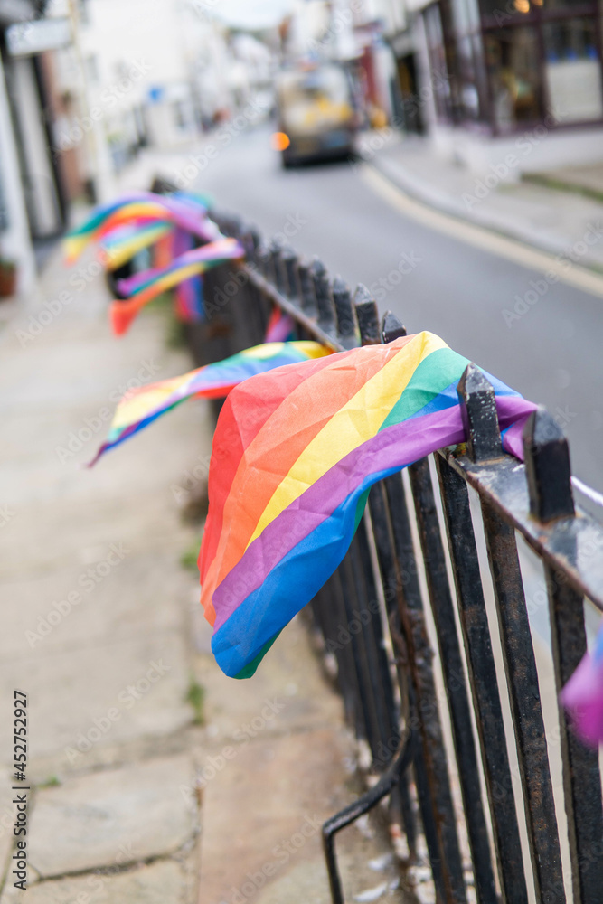 Group of LGTB flags waving on a balcony in the streets of UK.