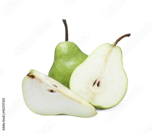 Whole and cut fresh ripe pears on white background