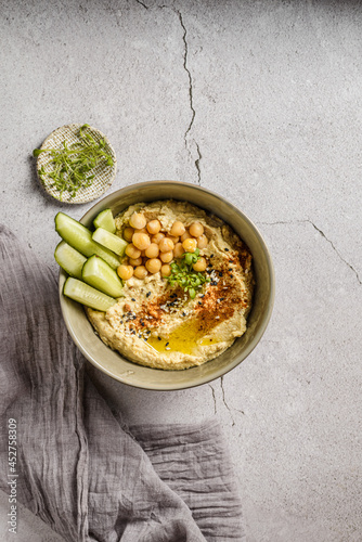 hummus with cucumber and sesame seeds