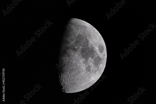 First quarter (half) moon close-up with black universe background