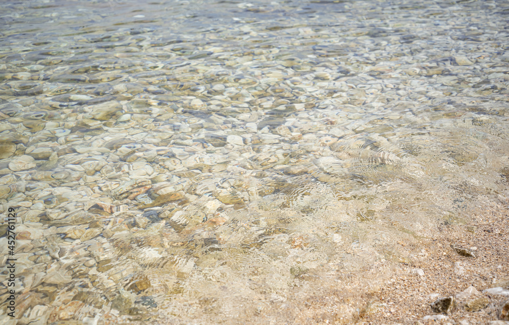 The bottom of the sea with small pebbles along with water. The bottom of the sea with small pebbles along with water.