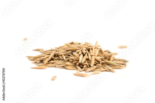 handful of dry oats on white isolated background