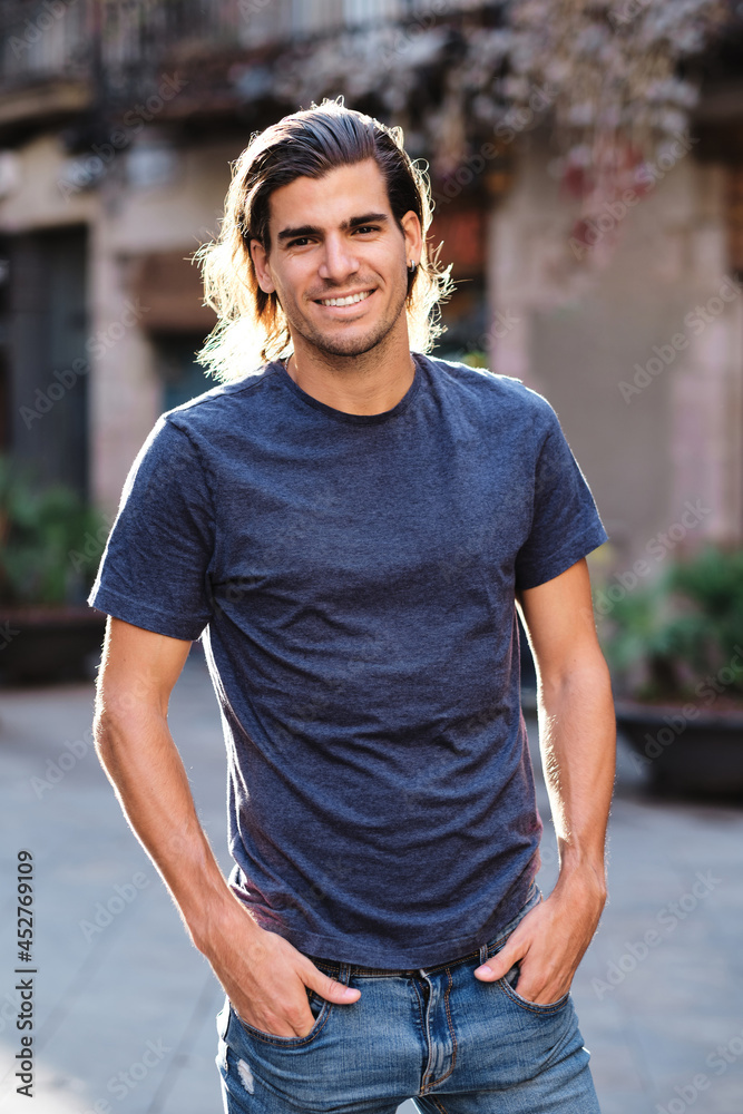 top model man using blue t-shirt and looking at camera for social media or dating apps top model man using blue t-shirt and looking at camera for social media or dating apps