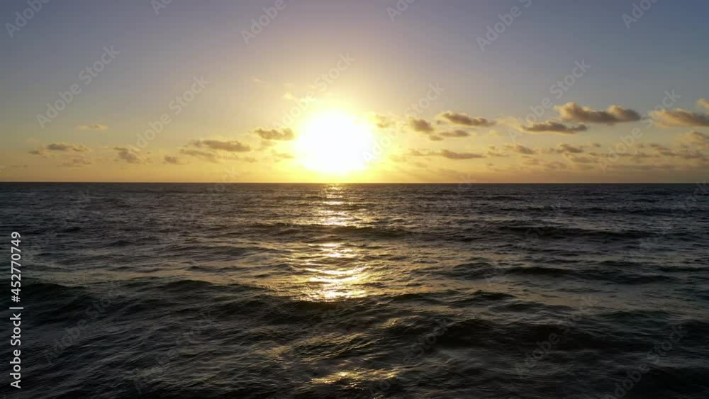 Aerial: Idyllic View Of Waves In Ocean Against Cloudy Sky During Sunset - Cozumel, Mexico Aerial: Idyllic View Of Waves In Ocean Against Cloudy Sky During Sunset - Cozumel, Mexico