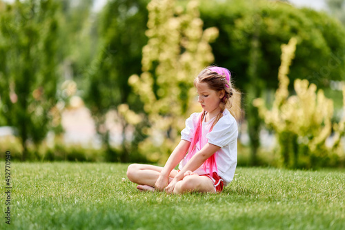 child girl with braided hair style with pink kanekalon photo