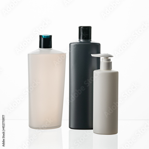 Silhouette of different types and sizes of plastic bottles on white isolated background