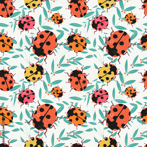 Ladybug seamless pattern vector illustration. Cute meadow insect texture design. Lady-beetle summer background. Floral bloom with lady-cows wrapping. © SickleMoon