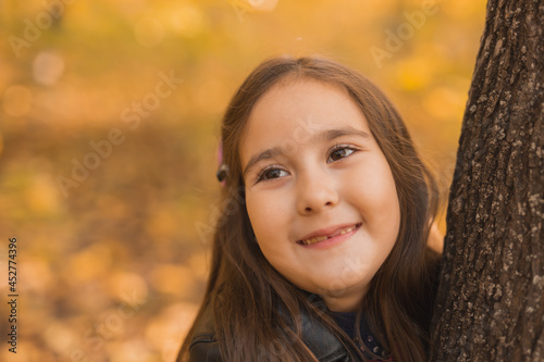 Autumn portrait of cute little asian girl. Children, fall and season concept.