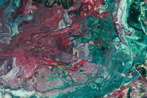 Fluid with a mixture of red and green. Modern trend fluid. Bright marble fluid.
