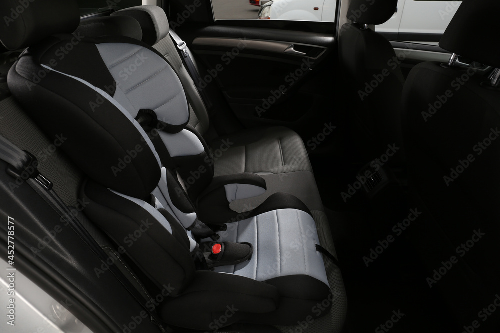 Empty modern child safety seat in car