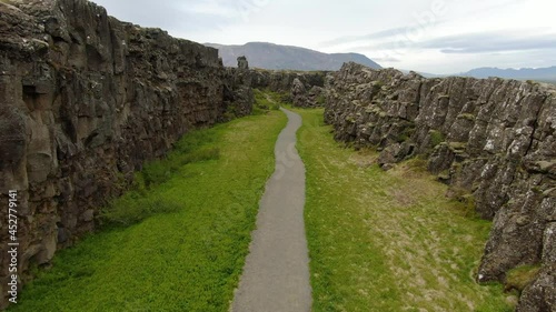Footpath between tectonic plates in Thingvellir National Park in Iceland photo