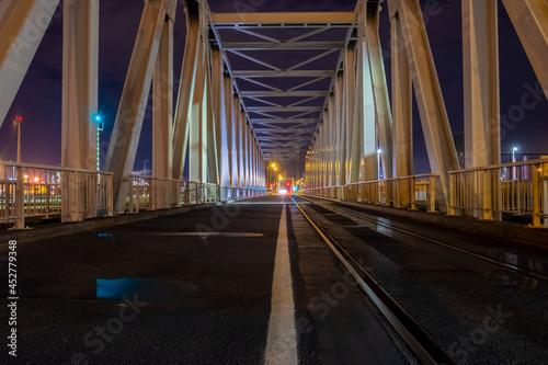 Night view of illuminated bridge above of river Scheldt in Antwerp, Belgium. High quality photo