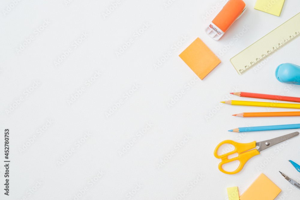 Flat lay frame with school and office supplies on a white background Flat lay frame with school and office supplies on a white background