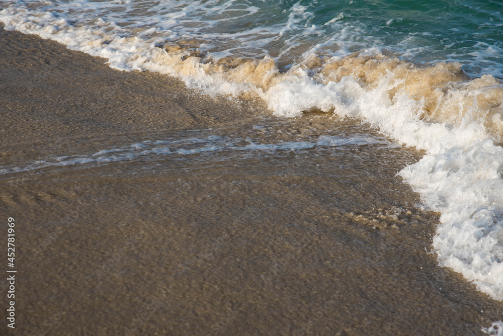 Sea or ocean tropical landscape view. Sea waves under the sun. Summer vacation and travel concept. Water wave surface. Sand beach. 