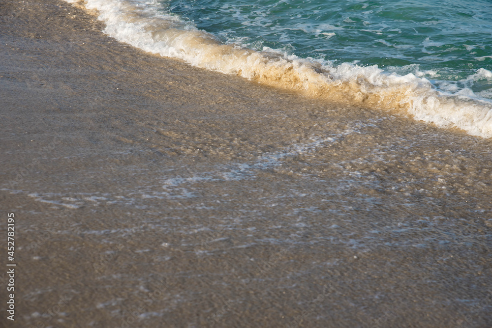 Sea or ocean tropical landscape view. Sea waves under the sun. Summer vacation and travel concept. Water wave surface. Sand beach. Sea or ocean tropical landscape view. Sea waves under the sun. Summer vacation and travel concept. Water wave surface. Sand beach.