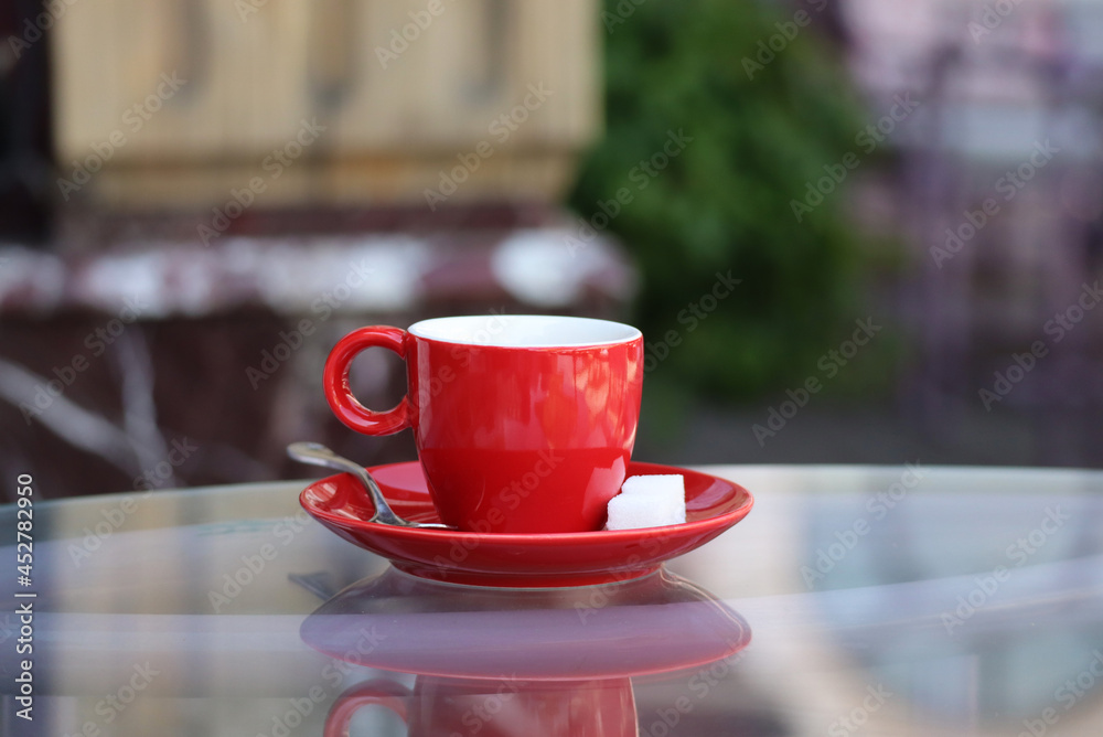 Red cup of coffee on the table Red cup of coffee on the table