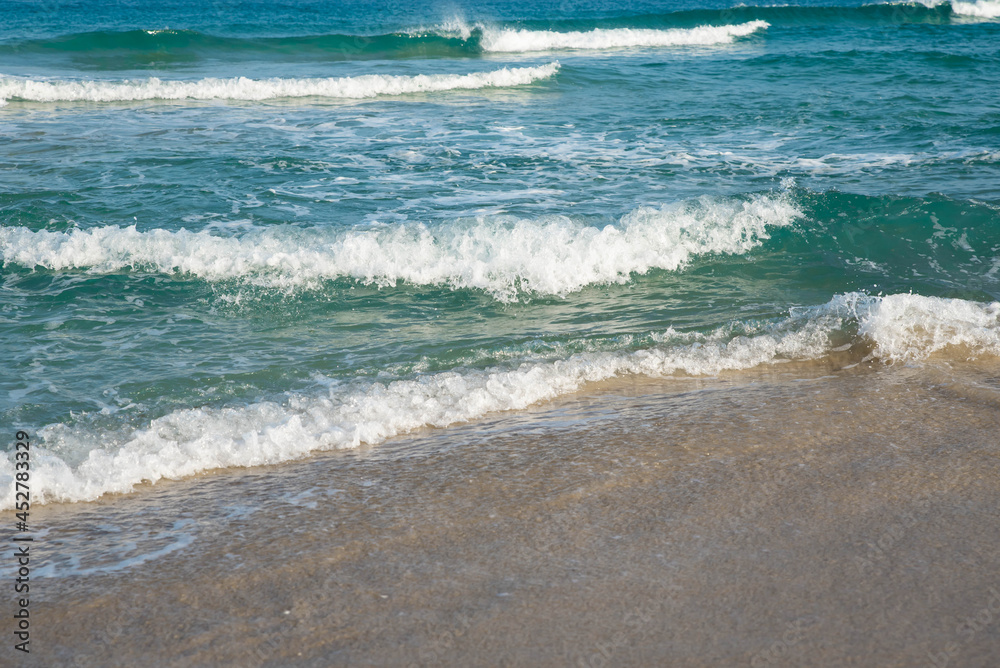Sea or ocean tropical landscape view. Sea waves under the sun. Summer vacation and travel concept. Water wave surface. Sand beach. Sea or ocean tropical landscape view. Sea waves under the sun. Summer vacation and travel concept. Water wave surface. Sand beach.