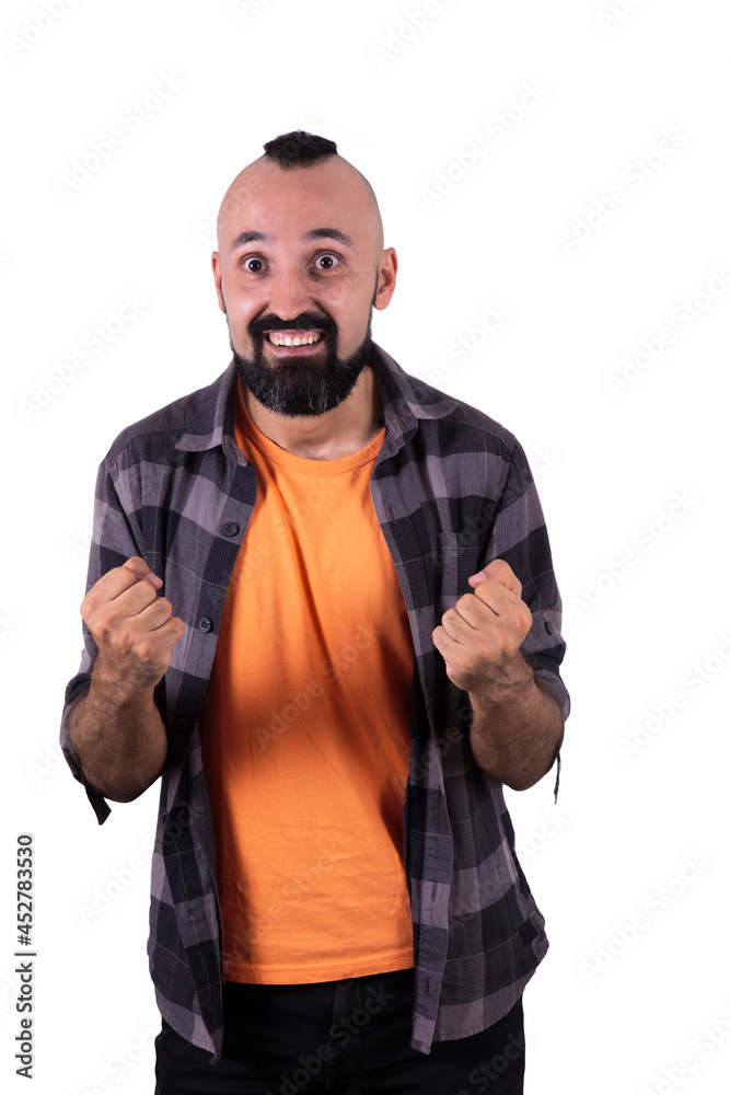 Excited young man cheering up looking at camera Excited young man cheering up looking at camera