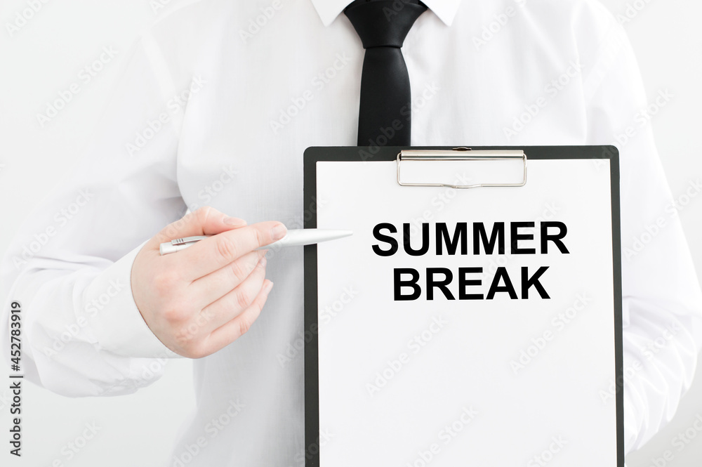 man hands holding a white sheet tablet with the text summer break written in it, one hand points to the inscription on the tablet man hands holding a white sheet tablet with the text summer break written in it, one hand points to the inscription on the tablet
