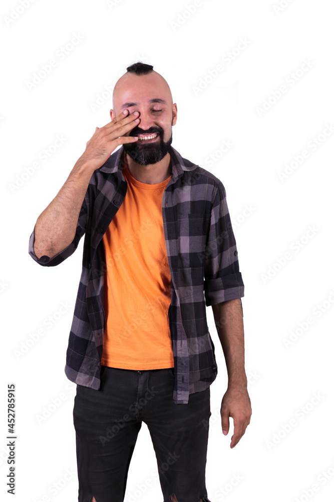 Happy young man wiping his tears and laughing Happy young man wiping his tears and laughing