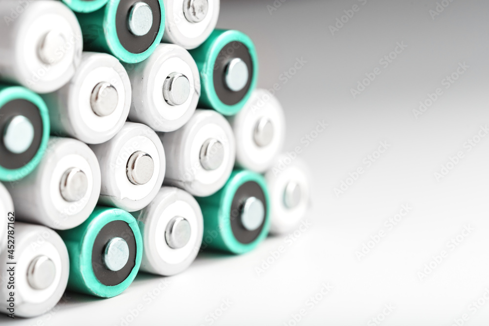 AA batteries in rows on a white background with free space. AA batteries in rows on a white background with free space.