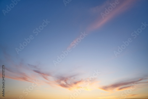 Real sundown sunset sky with beautiful light clouds and sun, wothout any birds. Huge resolutions photo