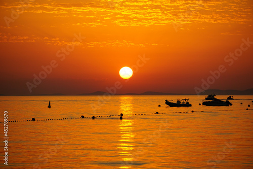 Vibrant orange sunset during high heat waves and climate change