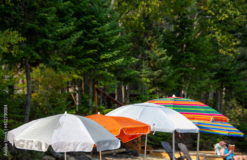 Beach umbrella under an August sun near a wild lake in Quebec  Canada