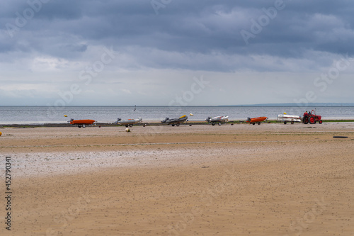 Langrune-Sur-Mer, France - 08 05 2021: Zodiacs pulled by tractor on the beach