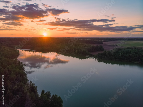 Fototapeta Naklejka Na Ścianę i Meble -  Magical sunset over lake in Belarus. Drone aerial photo
