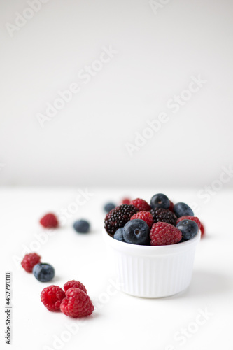 Fresh summer berries on white background