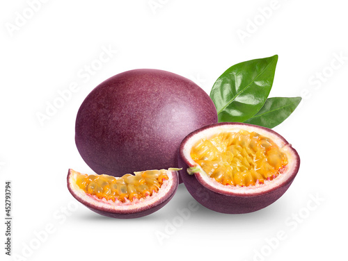 Fototapeta Naklejka Na Ścianę i Meble -  Delicious ripe passion fruits and green leaves on white background