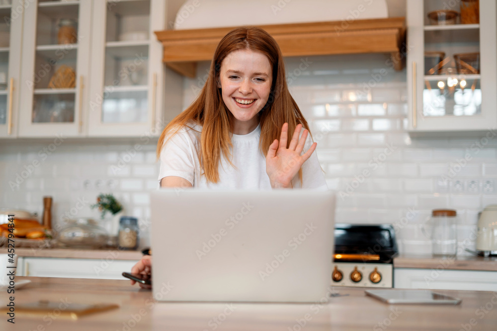 A student communicates with friends on a social network. A female freelancer works at home on a laptop. A student communicates with friends on a social network. A female freelancer works at home on a laptop.