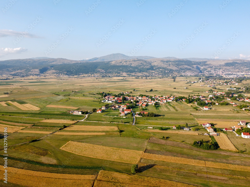 Obraz premium Arial drone view of field at summer. Field, villages and river.
