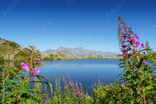 Lake le Lac Besson, Alpes d'Huez. French Alps. Reflection and blue sky.  photo