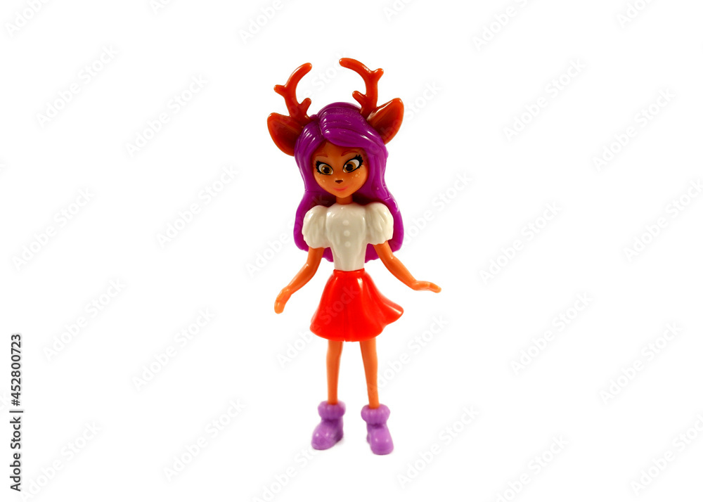 Fototapeta premium Figurine of a girl with a deer head on a white background