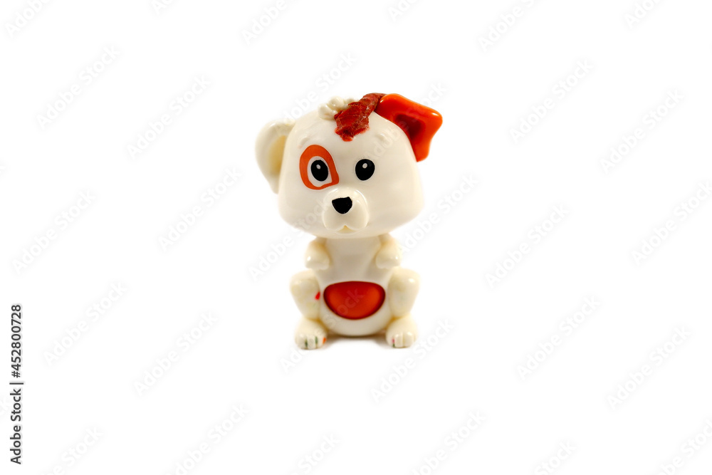 Small toy dog on a white background. Plastic toy Small toy dog on a white background. Plastic toy