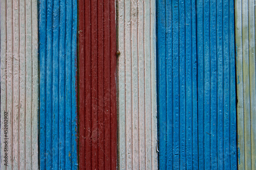 Wall of wood planks red, white and blue color background
