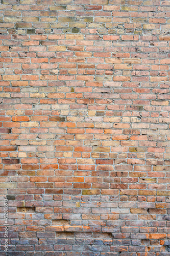 Brick wall as a rough textured and patterned abstract background 