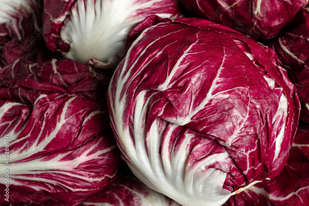 Obraz premium Whole fresh ripe radicchios as background, closeup