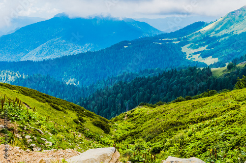Fototapeta Naklejka Na Ścianę i Meble -  Beautiful Summer sunny mountains with clouds and meadow
