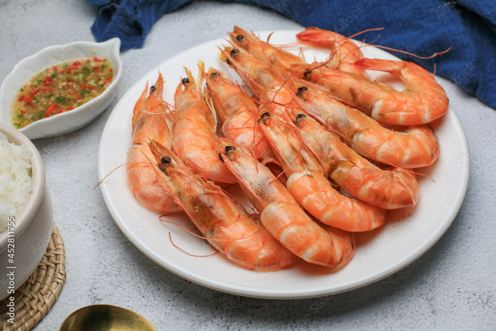 Fresh boiled big sea shrimps (prawns) with spicy seafood sauce and rice. Healthy food. Cooked steamer food served seafood. Fresh boiled big sea shrimps (prawns) with spicy seafood sauce and rice. Healthy food. Cooked steamer food served seafood.