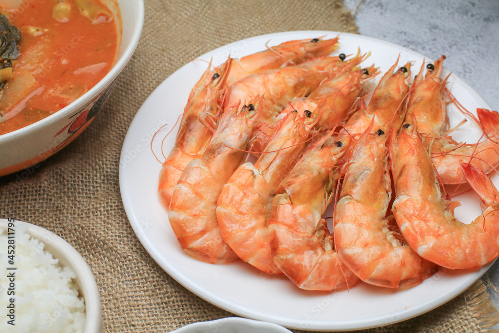 Fresh boiled big sea shrimps (prawns) with spicy seafood sauce and rice. Healthy food. Cooked steamer food served seafood. Fresh boiled big sea shrimps (prawns) with spicy seafood sauce and rice. Healthy food. Cooked steamer food served seafood.