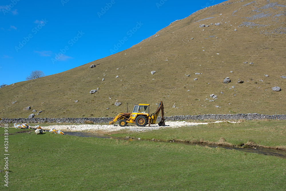 yellow excavator in the Yorkshire dales