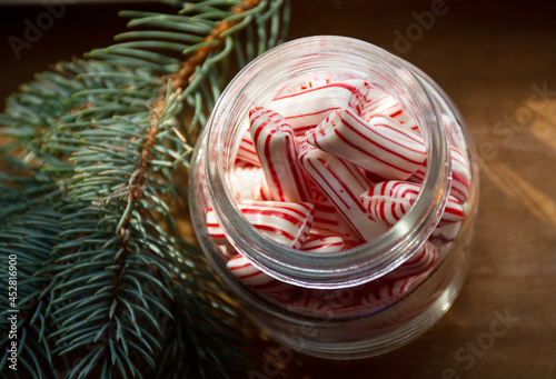 christmas striped candies in glass jar. Classical holiday treat 