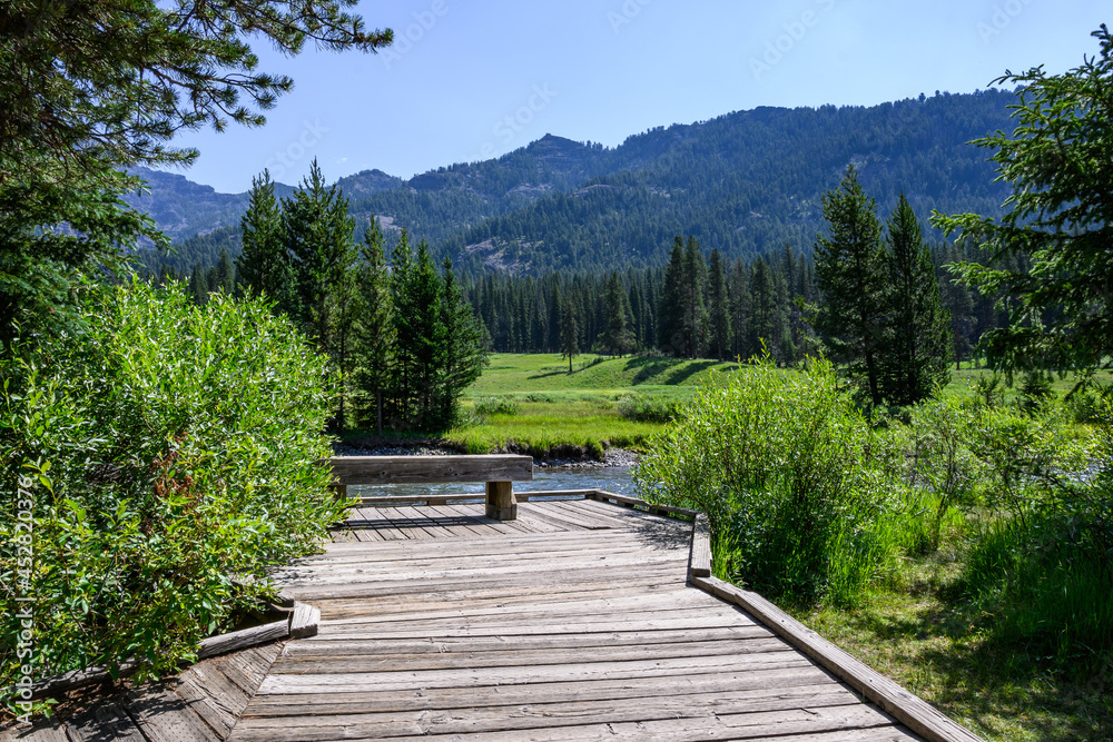 Tranquil outdoor setting with wood bench for contemplation on Soda Butte Creek, Yellowstone National Park, USA
Tranquil outdoor setting with wood bench for contemplation on Soda Butte Creek, Yellowstone National Park, USA